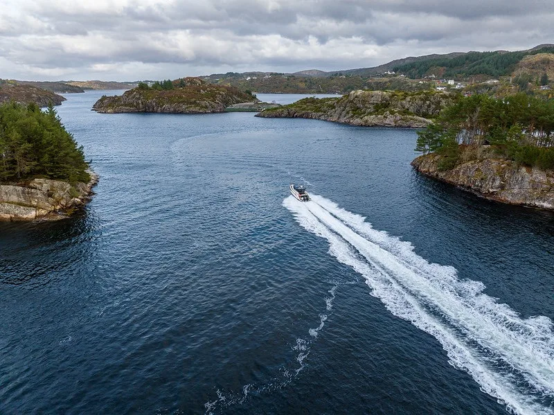 The NAVAN S30 cruising calm, sheltered water under a moody overcast sky