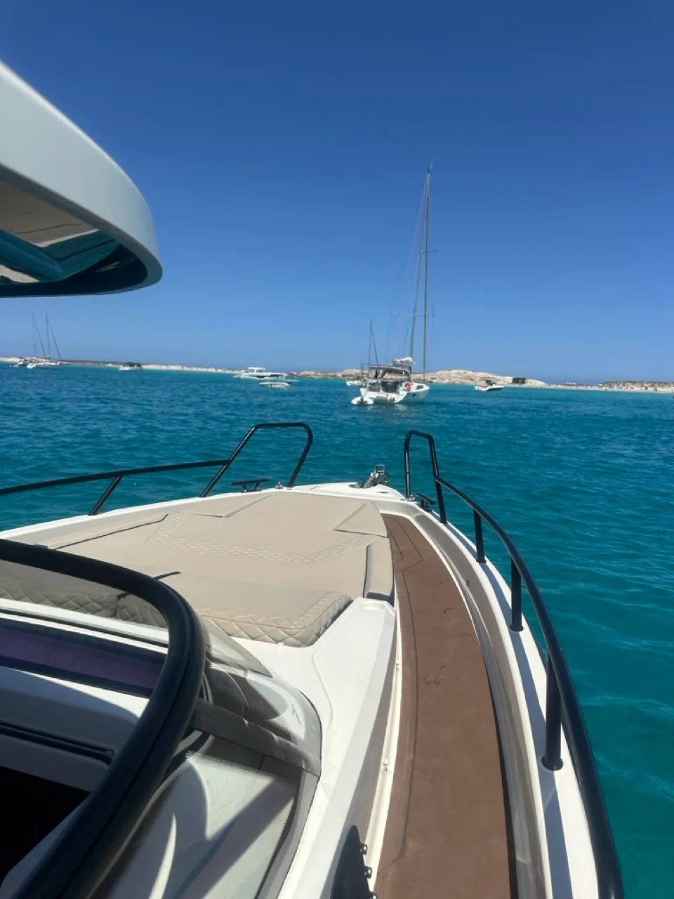 The NAVAN S30 at anchor in the shallow turquoise waters of a Formentera bay