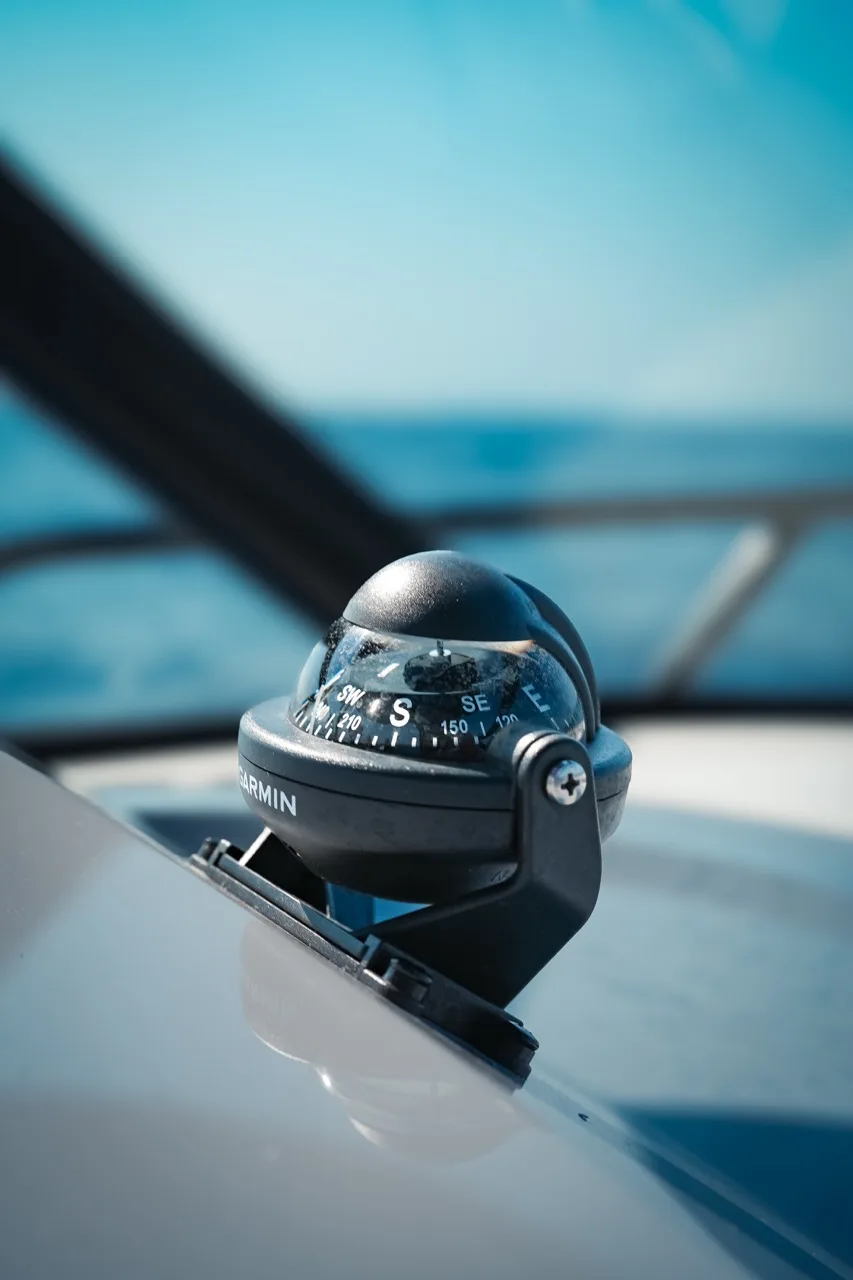 The ball compass on the dashboard of our NAVAN S30 holding a steady course near Es Vedrà